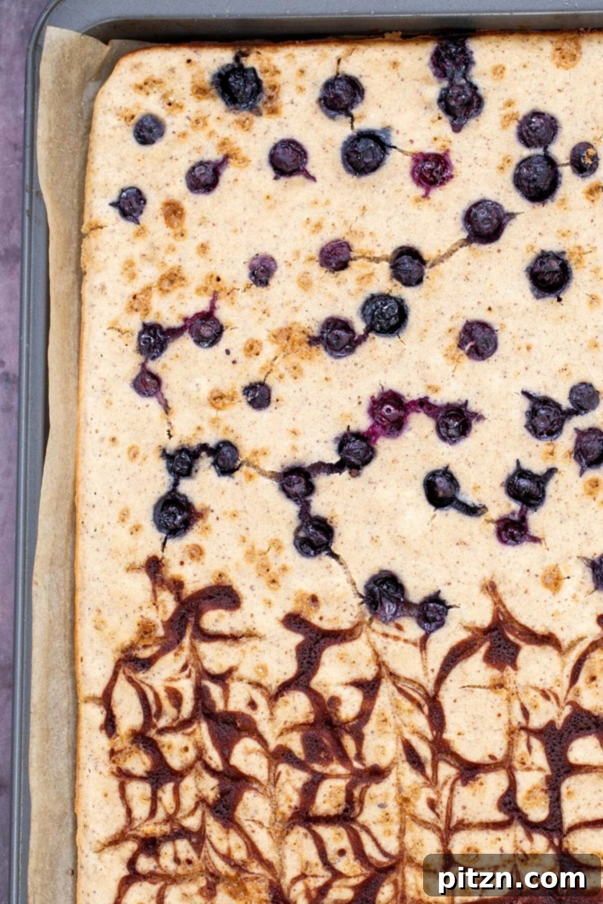 vegan sheet pan pancakes freshly baked vegan sheet pan pancakes with cinnamon swirl and blueberries