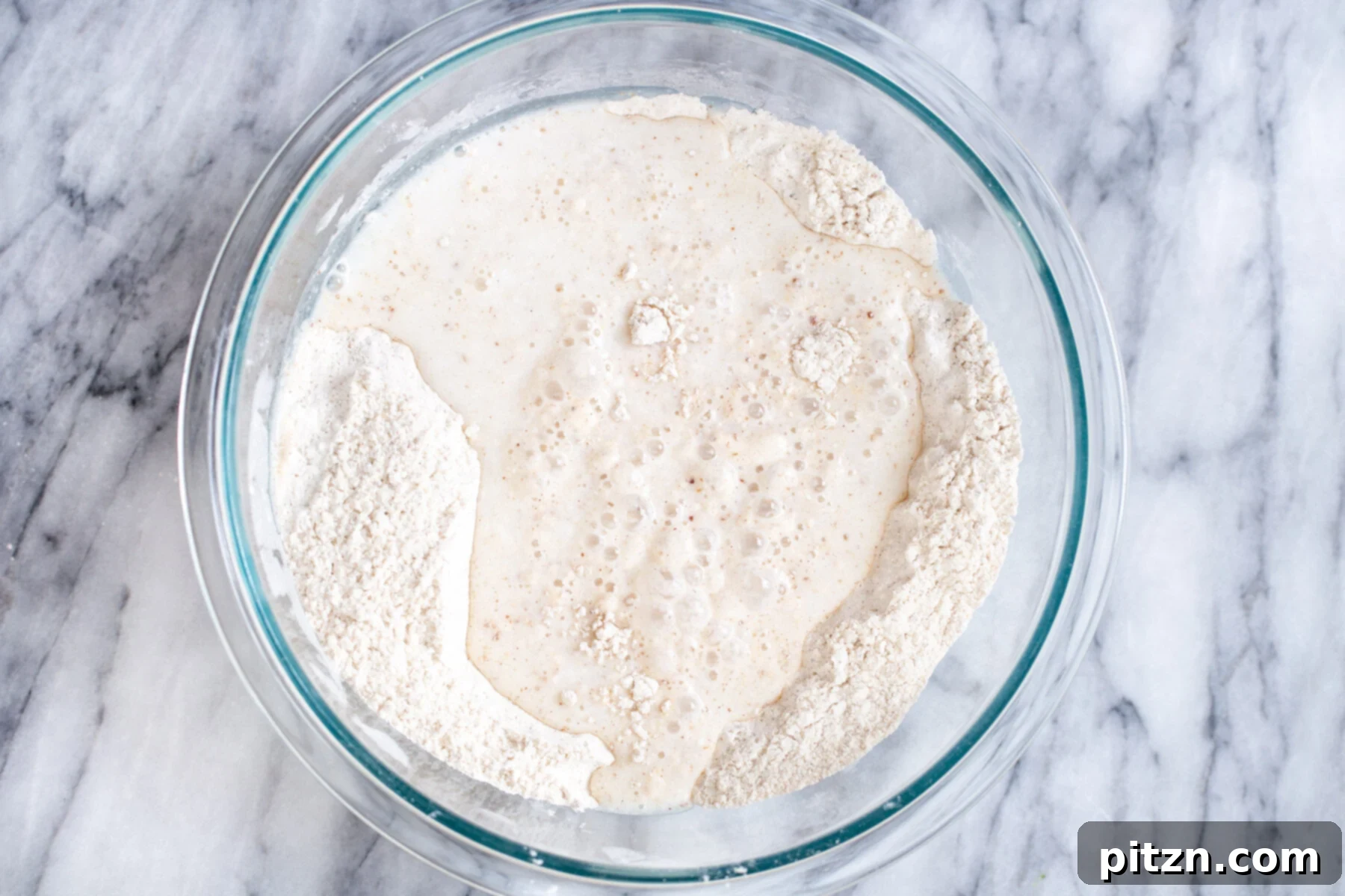 vegan sheet pan pancakes wet and dry ingredients for vegan sheet pan pancakes in a glass bowl