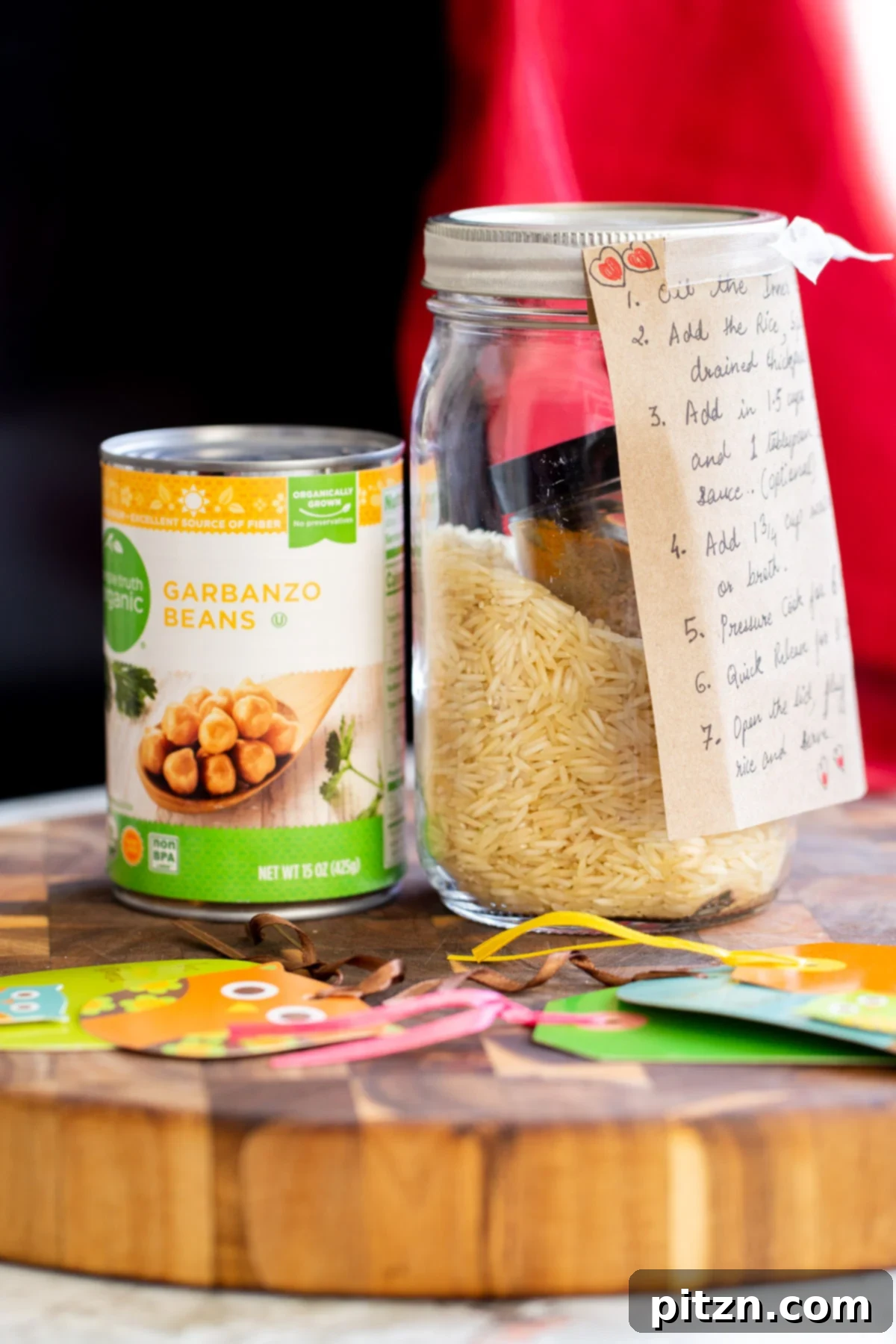 Instant Pot Curried Chickpea and Rice Mason Jar Meal 2 can of chickpea next to a jar with chickpea fried rice mix