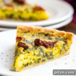 a slice of vegan quiche with spinach and leeks