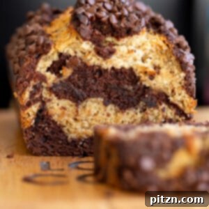 a sliced loaf of vegan marbled chocolate banana bread