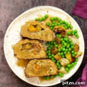 Gluten-free holiday roast made with chickpeas and tofu, filled with roasted vegetables, and glazed with a sweet and sticky sauce.