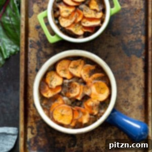 Our Vegan Mushroom Pot Pie in green and blue baking dishes on a baking sheet