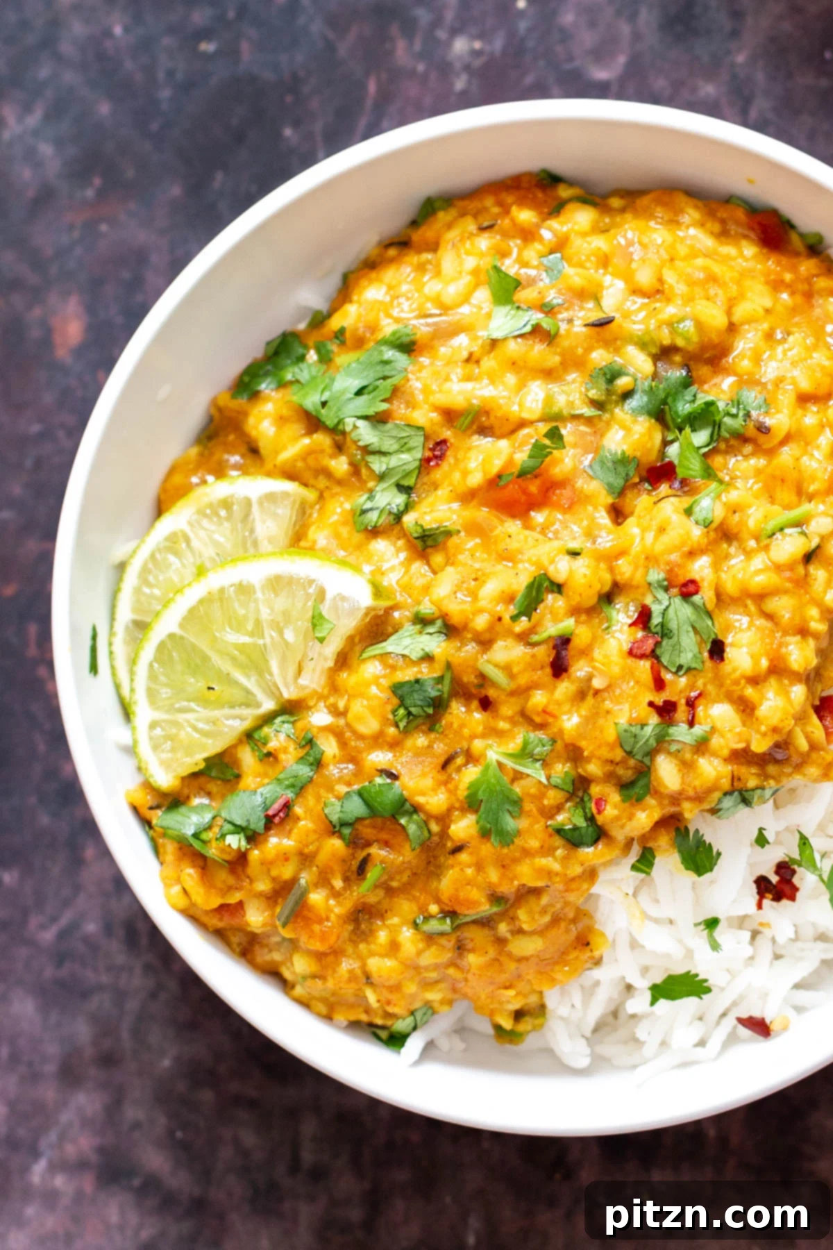 spicy urad dal Spicy Urad Dal served over fragrant basmati rice, garnished with fresh cilantro and a wedge of lime