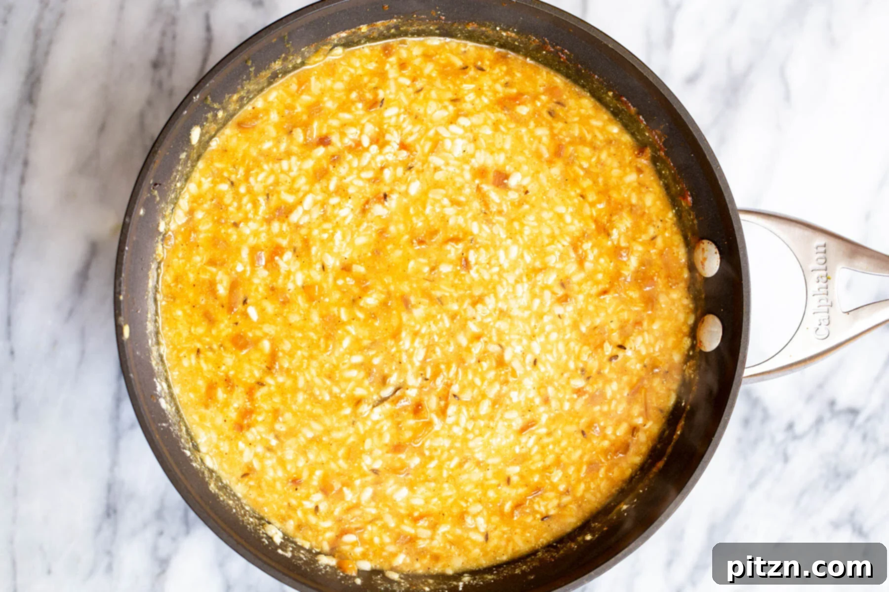 Spicy Black Gram Dal 16 Spicy Urad Dal simmering in a black skillet, showcasing its rich texture and depth of flavor