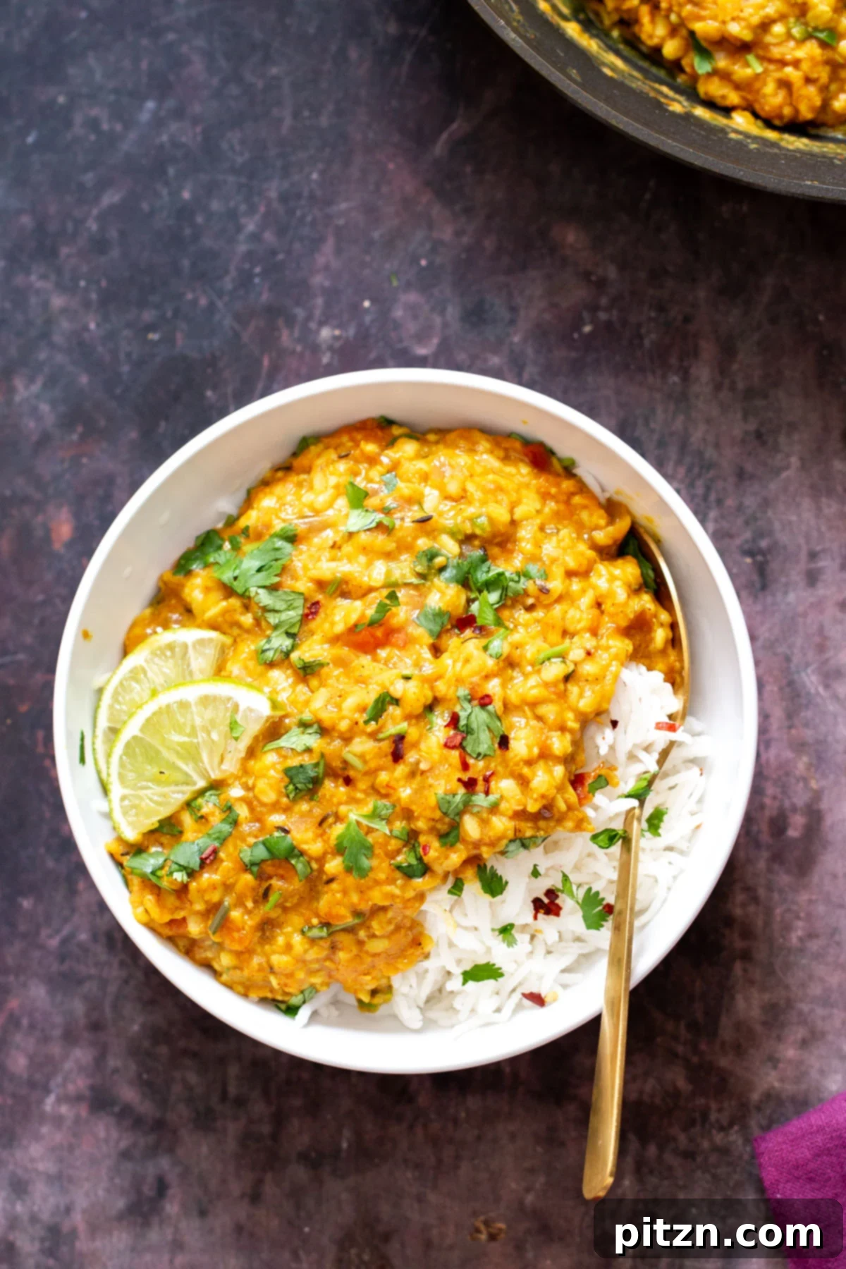 spicy ural dal A bowl of spicy urad dal served alongside fluffy white rice, ready to be enjoyed