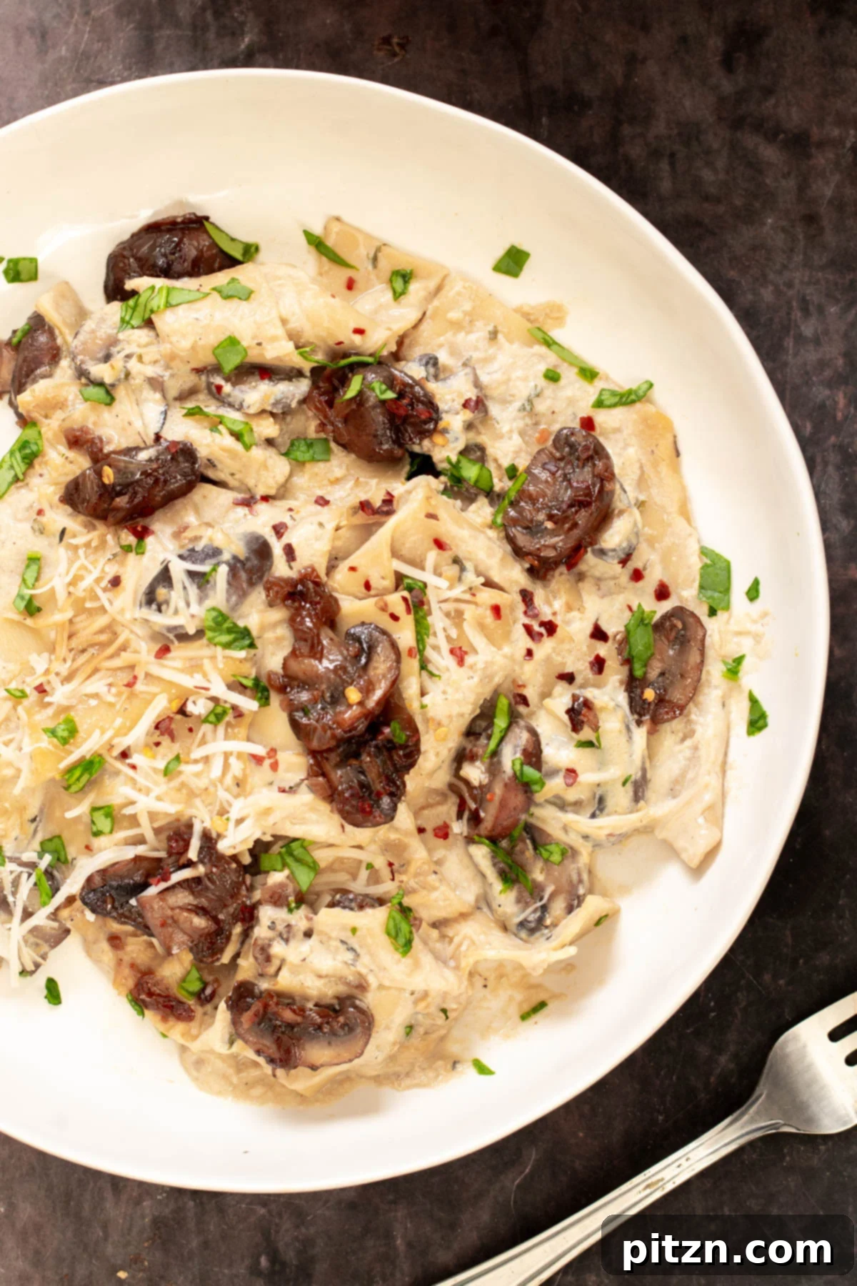 Effortless One-Pan Vegan White Lasagna with Tofu Bechamel 5 a serving of vegan white one pan lasagna with vegan bechamel and balsamic mushrooms