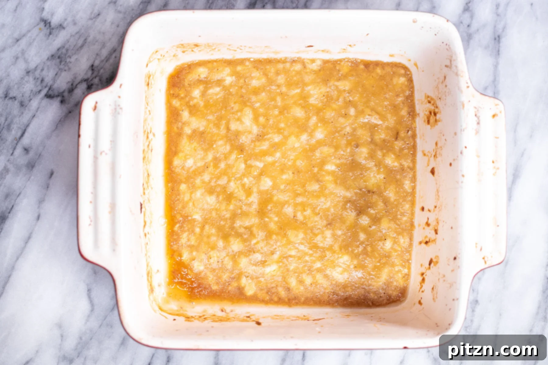 Cinnamon Streusel Vegan Banana Oat Squares 7 Roasted banana puree in a casserole dish, now ready to be combined with almond butter and other wet ingredients.