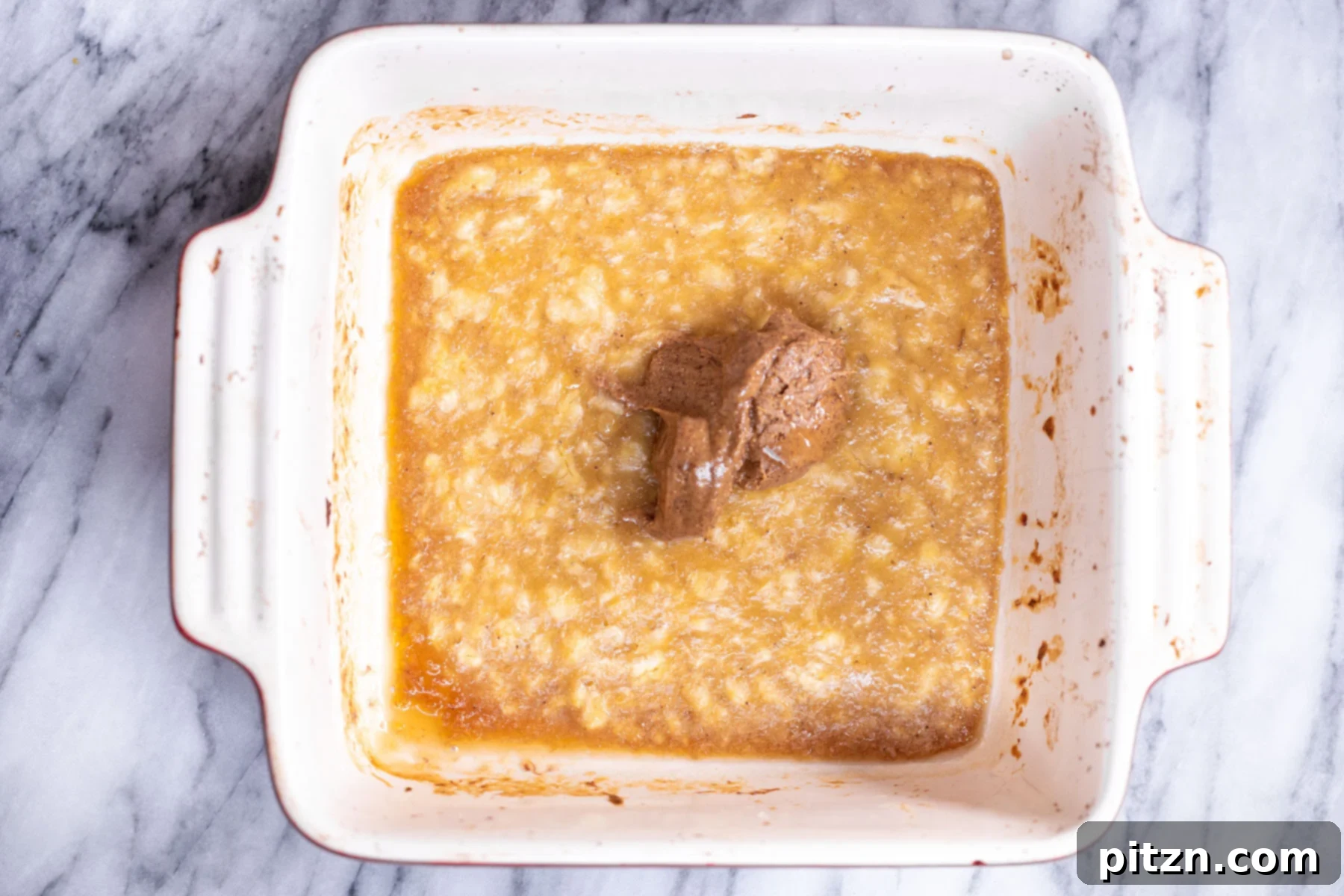 Cinnamon Streusel Vegan Banana Oat Squares 8 Smooth almond butter being added to the roasted banana puree, contributing to the bars' rich moisture and flavor.