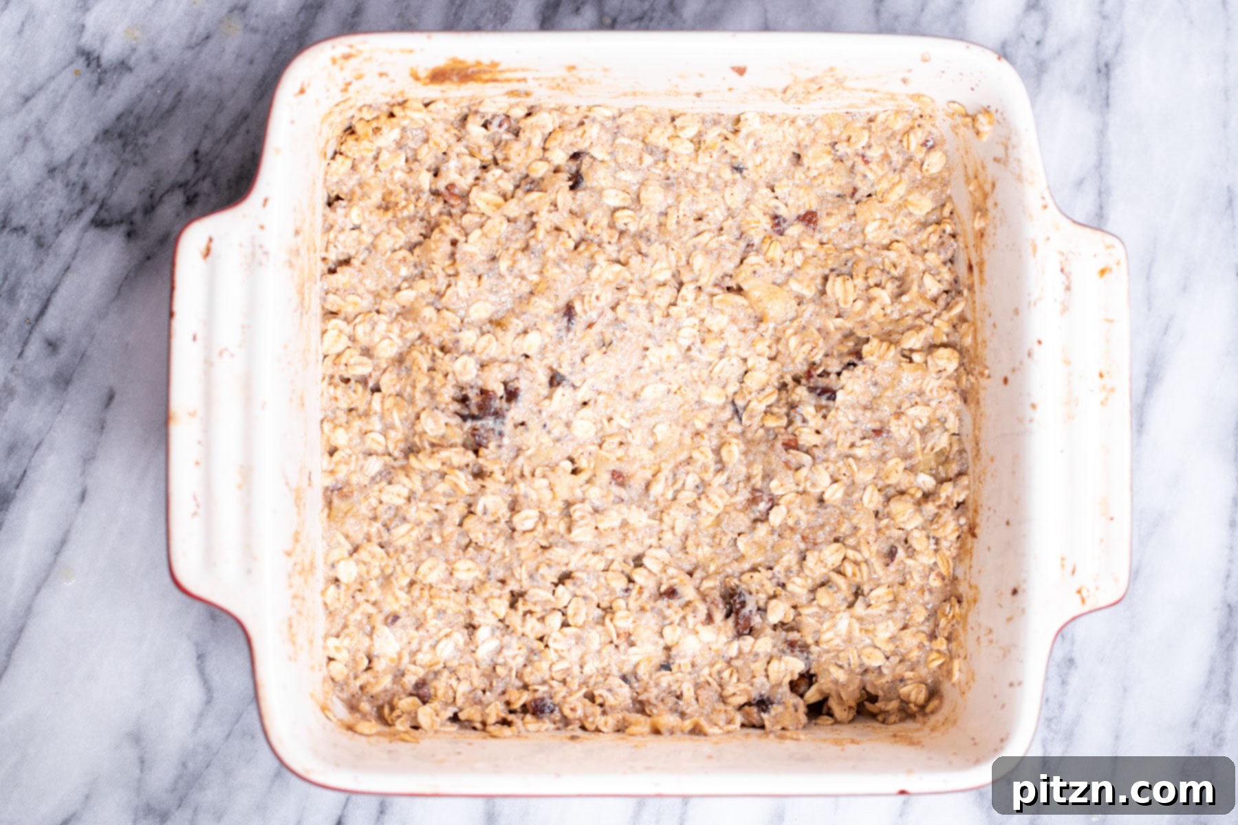 Cinnamon Streusel Vegan Banana Oat Squares 15 The fully mixed batter for banana oatmeal bars, evenly spread in a casserole dish and ready for the topping.