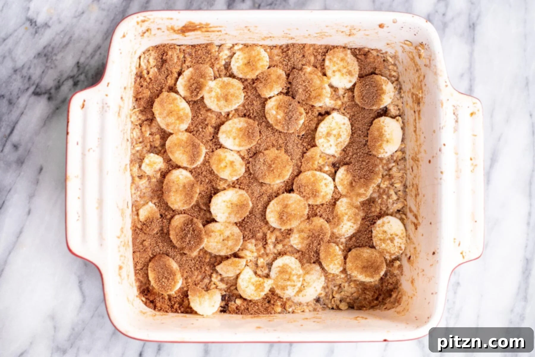 Cinnamon Streusel Vegan Banana Oat Squares 17 A generous sprinkling of coconut sugar and cinnamon streusel over the banana-topped oatmeal bars, enhancing flavor and texture.