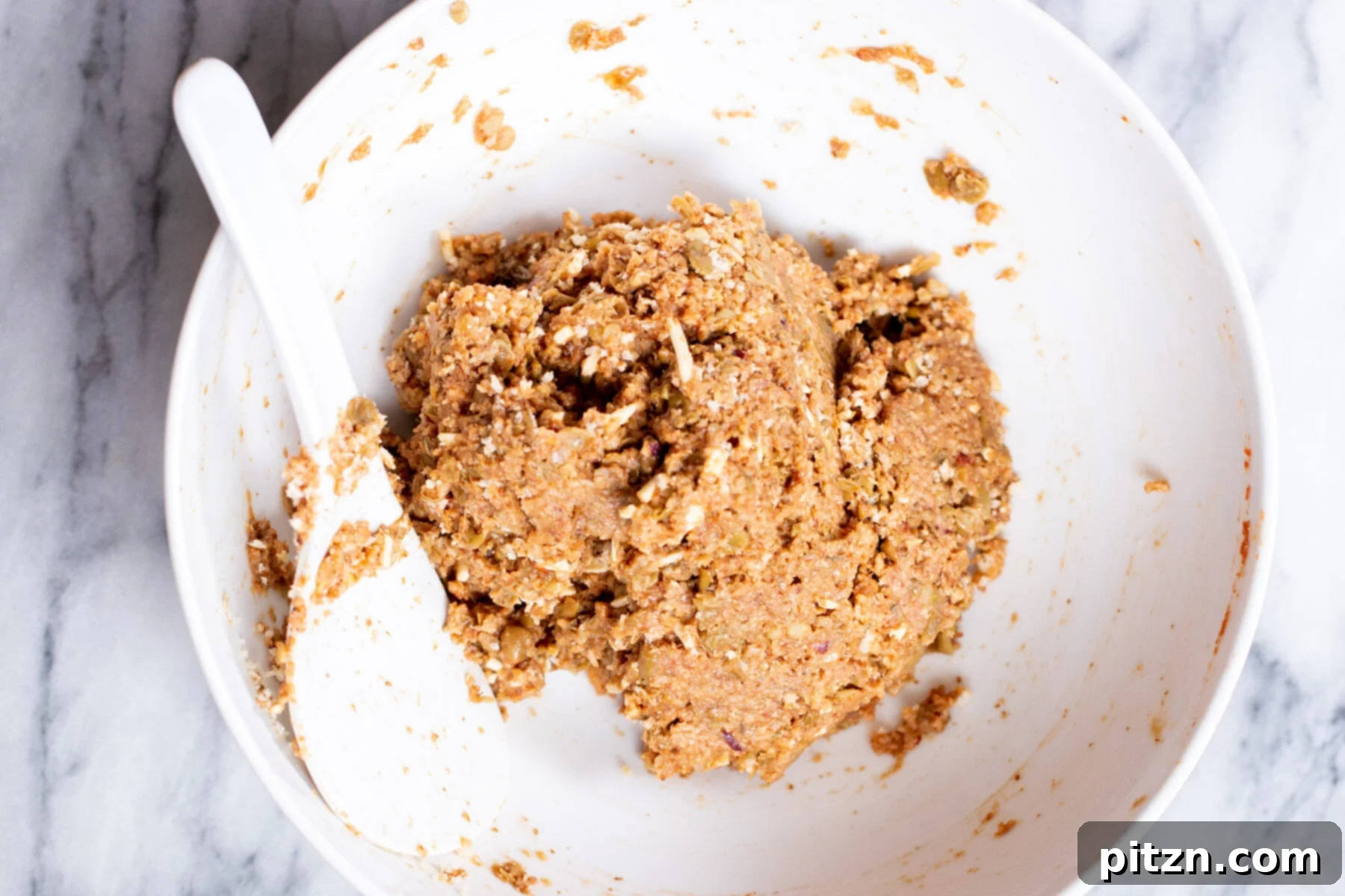 The vegan meatball mixture after adding breadcrumbs, achieving the ideal texture for shaping