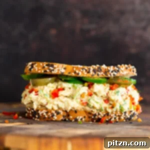 jalapeño popper chickpea salad sandwich on a chopping board
