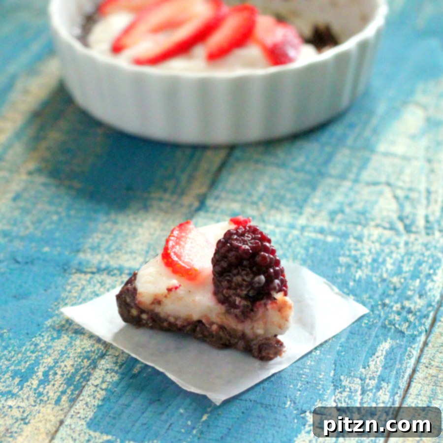 No Bake Vegan Gluten Free Chocolate Berry Fireworks Pie 3 Close-up of a small chocolate cream berry pie in a tart pan, ready to be served