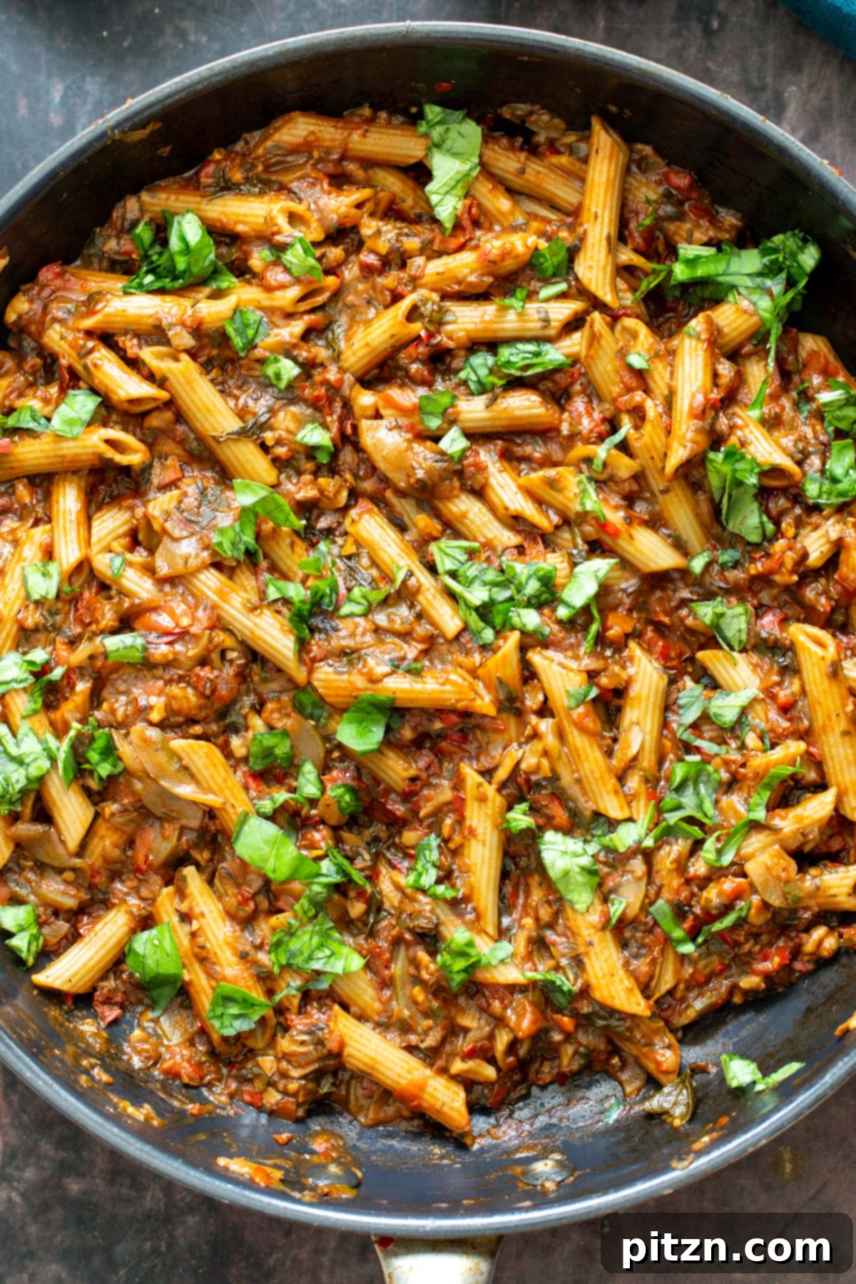 Rich, vibrant One-Pan Veggie Pasta in a black sauté pan, ready to serve.