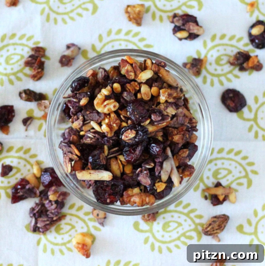 A close-up shot of crispy, golden berry granola in a bowl.