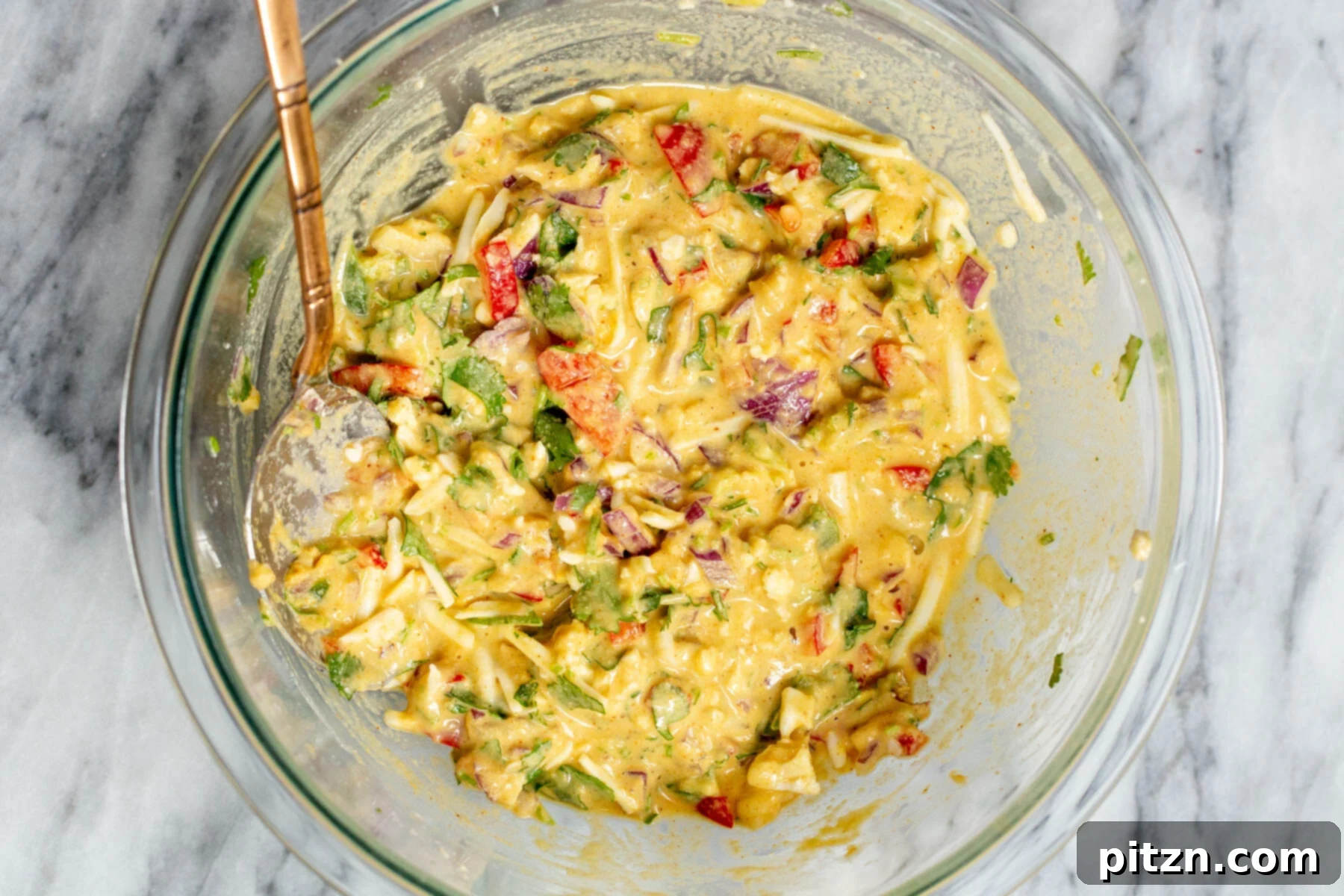 Savory Chickpea Flour Breakfast Combo 11 Vegan chickpea flour pancake batter in a glass bowl, perfectly mixed and ready to cook