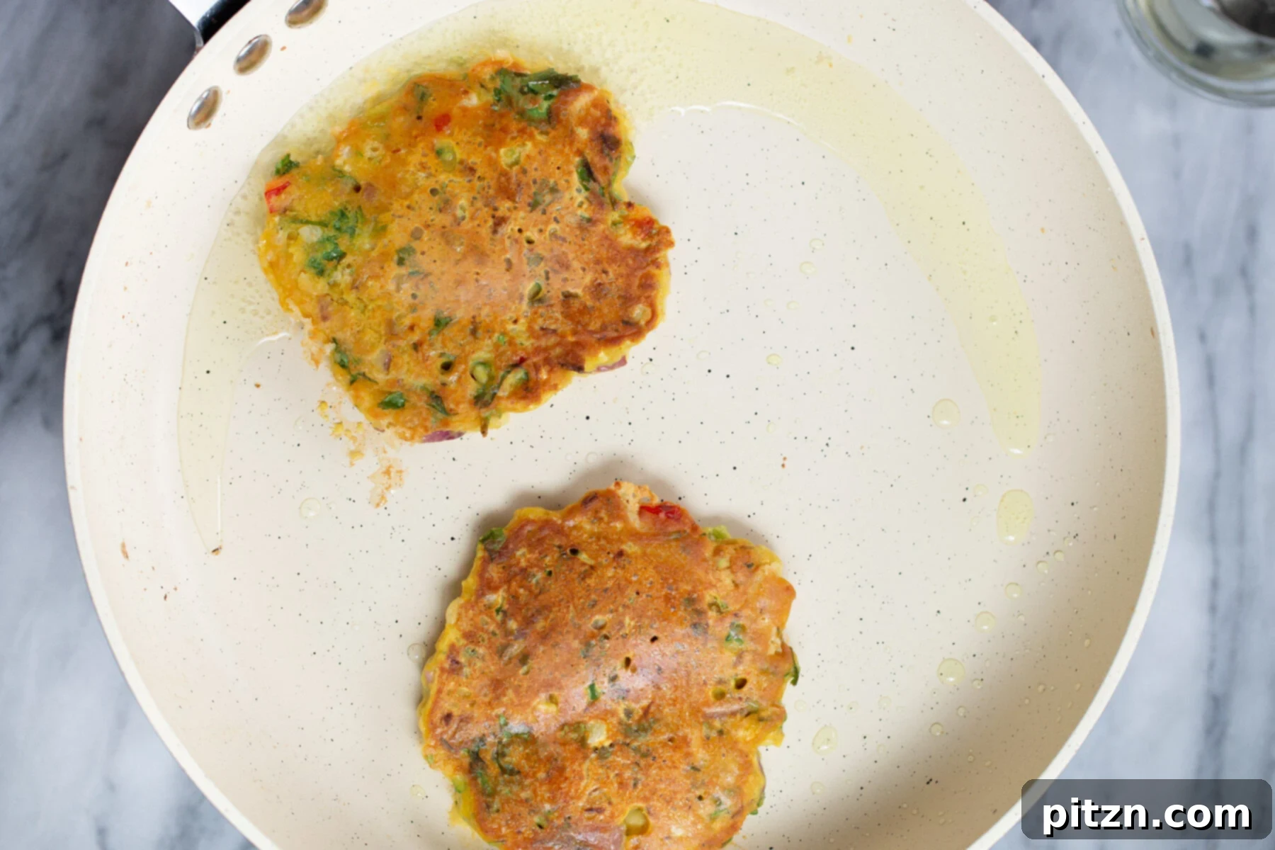 Savory Chickpea Flour Breakfast Combo 13 Vegan chickpea flour pancakes frying to golden perfection in a skillet