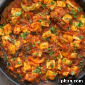 A delectable close-up of Tofu Jalfrezi in a skillet, ready to serve.
