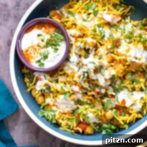 Golden Spiced Vegan Chickpea Rice Bake 4 A top-down view of a serving of Chana Pulao Casserole, garnished beautifully.