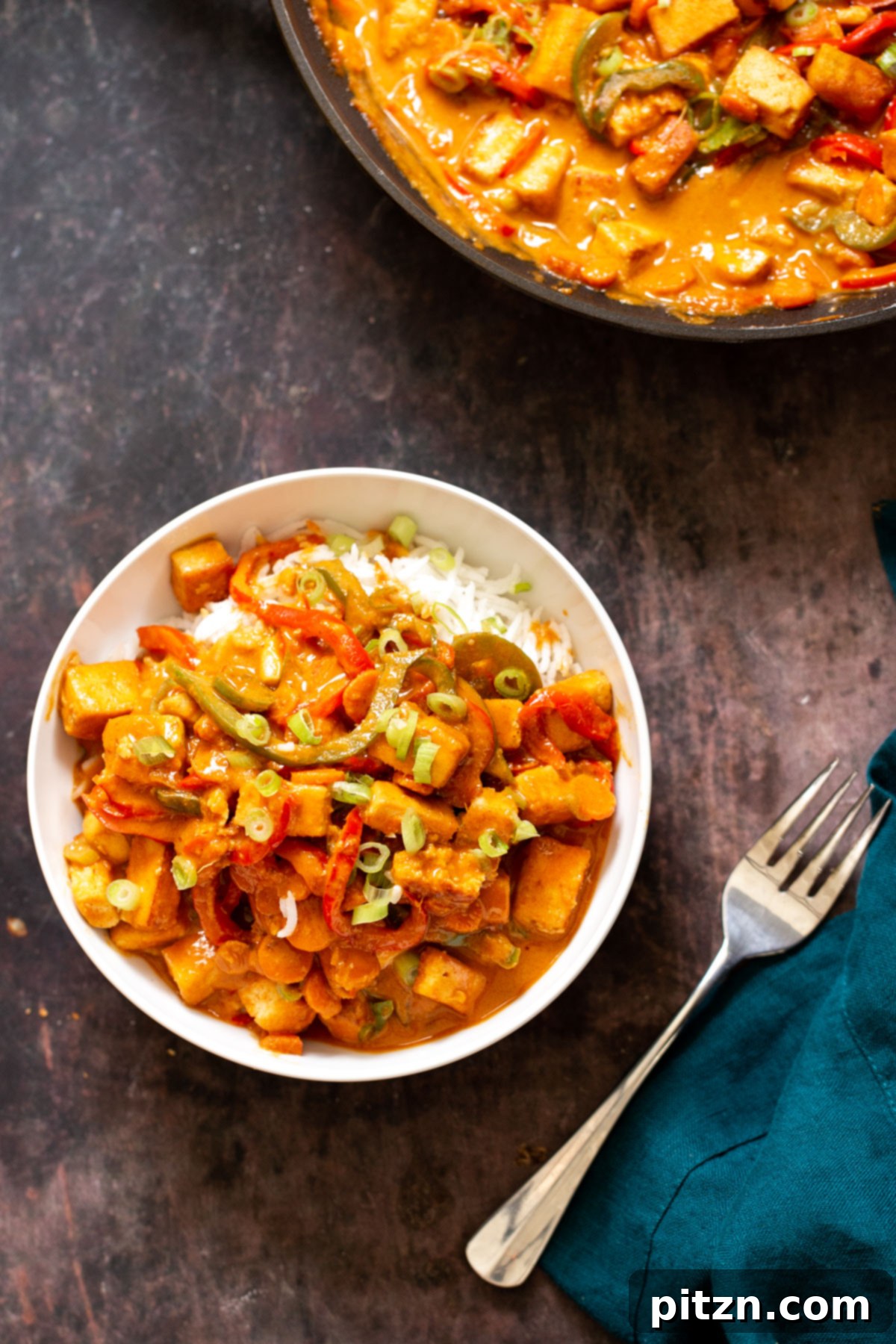 gochujang tofy stir-fry in peanut sauce served over rice