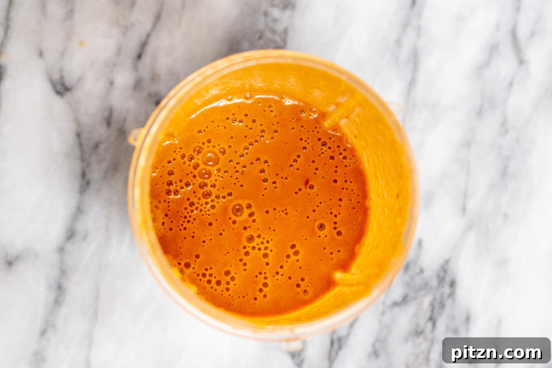 creamy stir-fry sauce in a small plastic container 