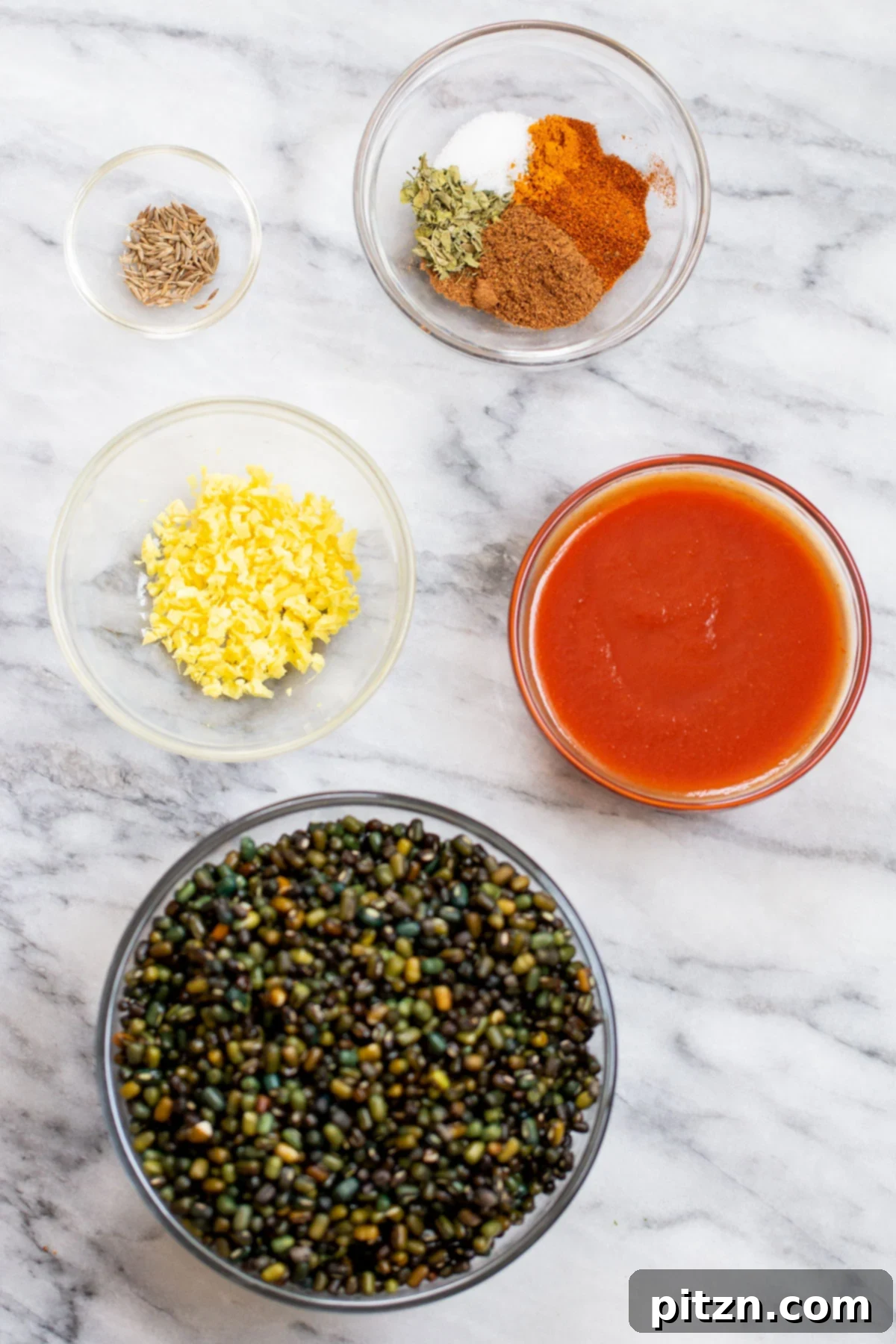 Instant Pot Dal Bukhara - Dump and Done Creamy Black Lentil Perfection 7 A collection of vibrant ingredients for making Dal Bukhara, neatly arranged around an Instant Pot, ready for preparation.