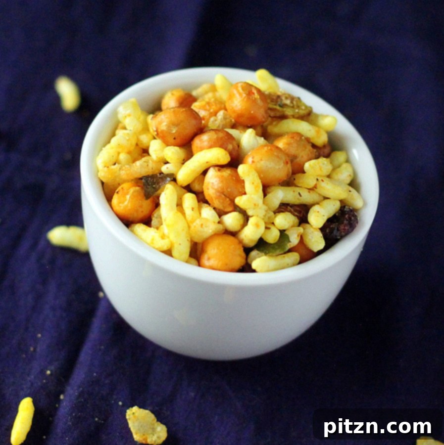 Chivda Savory PlantBased Crunch With Roasted Chickpeas And Fruits 4 A different angle of the Chivda, showing various nuts and dried fruits mixed in.