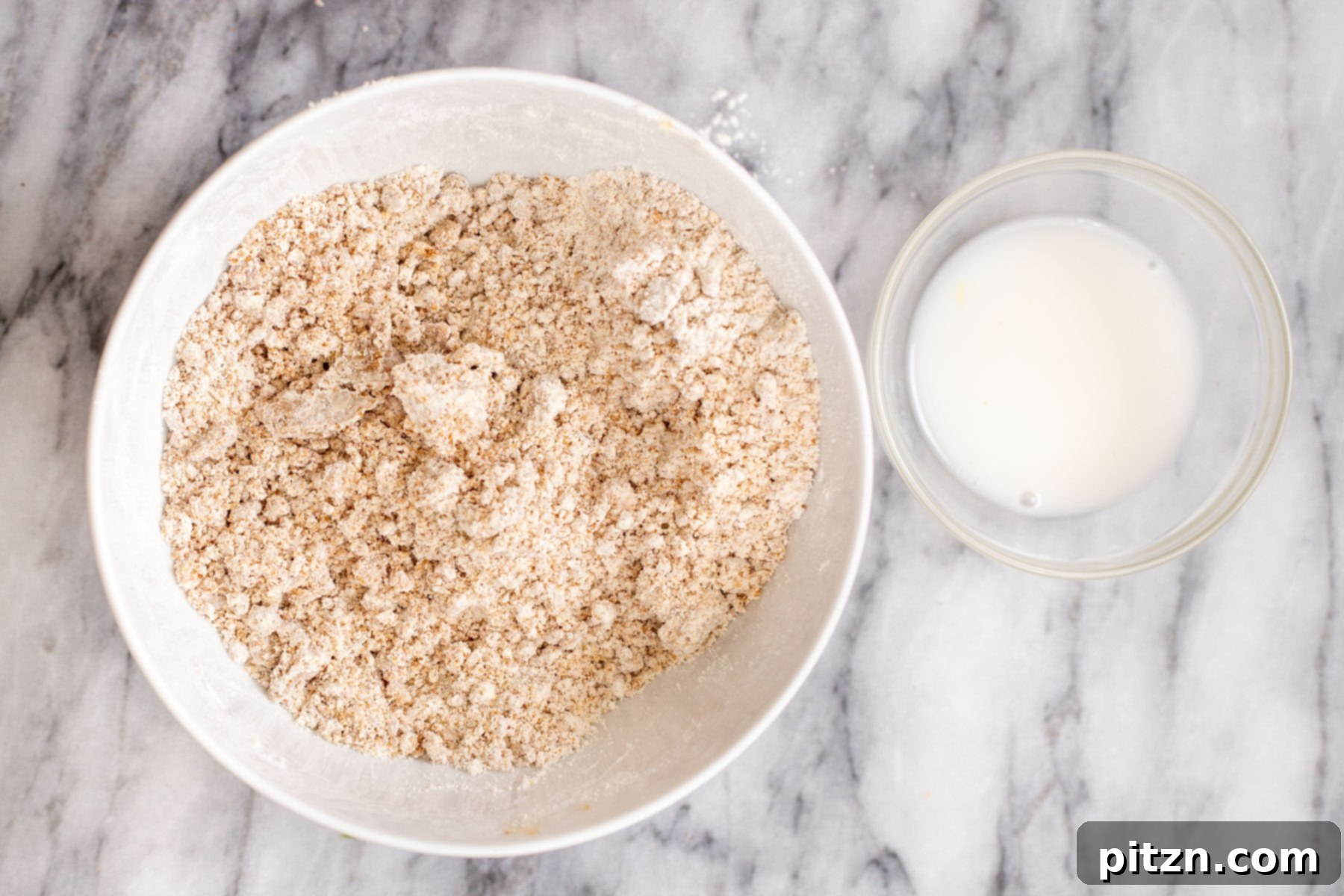 crust ingredients being combined in a white bowl 