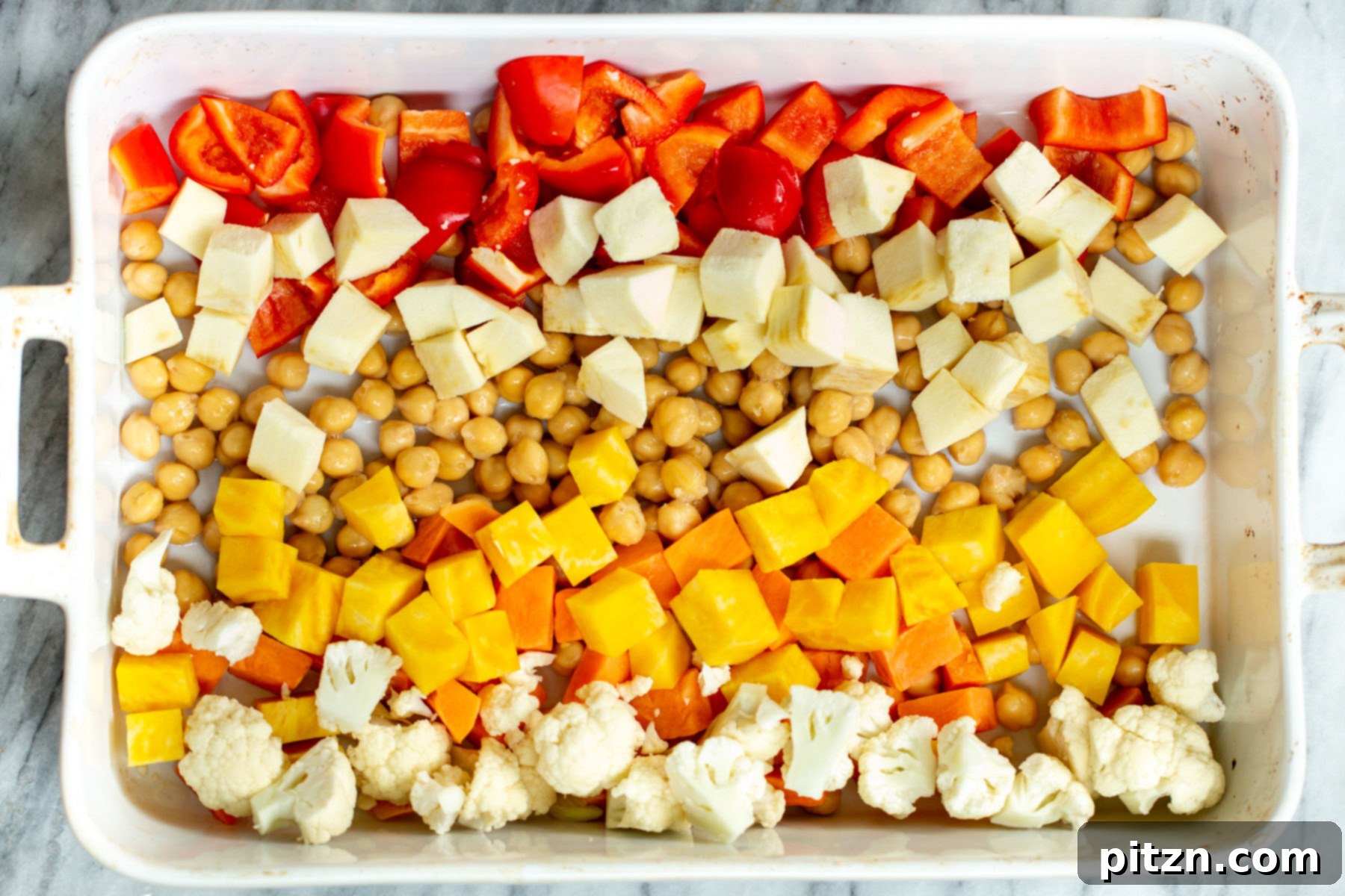 veggies arranged in a casserole dish according to color