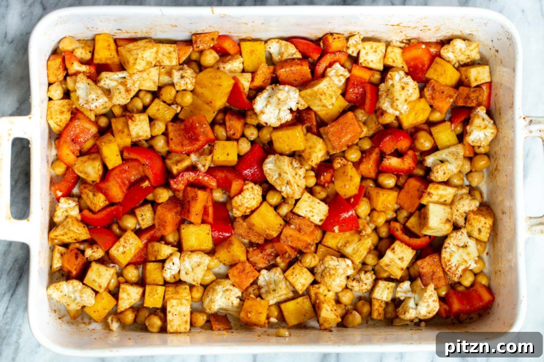 roasted root veggies in a white casserole dish