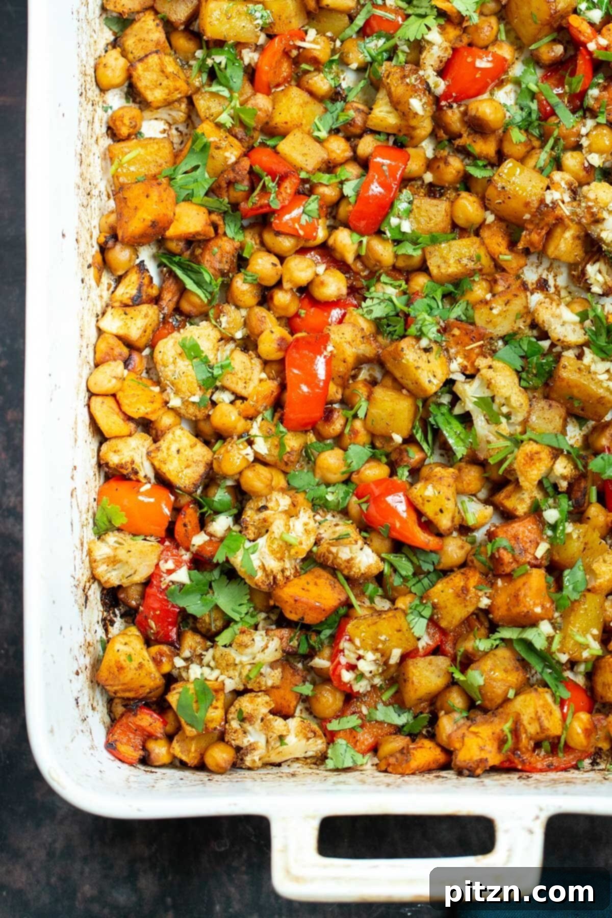 Mediterranean vegetable tray bake sprinkled with cilantro