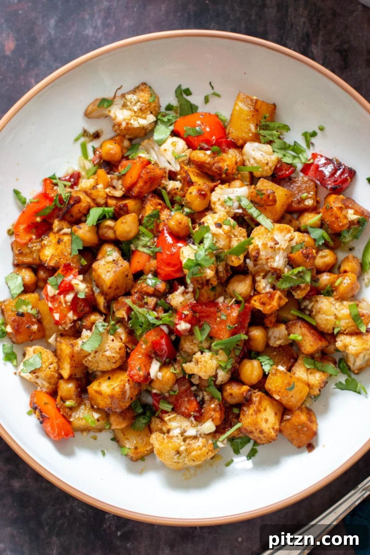 a plate with balsamic and maple roasted root vegetables and chickpeas