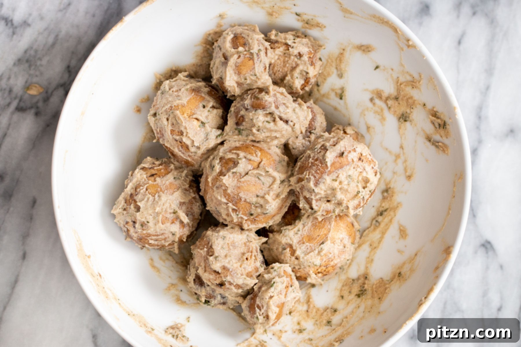 Swedish Plant-Ball Perfection 11 Cremini mushrooms, perfectly coated in the savory marinade, ready for baking.