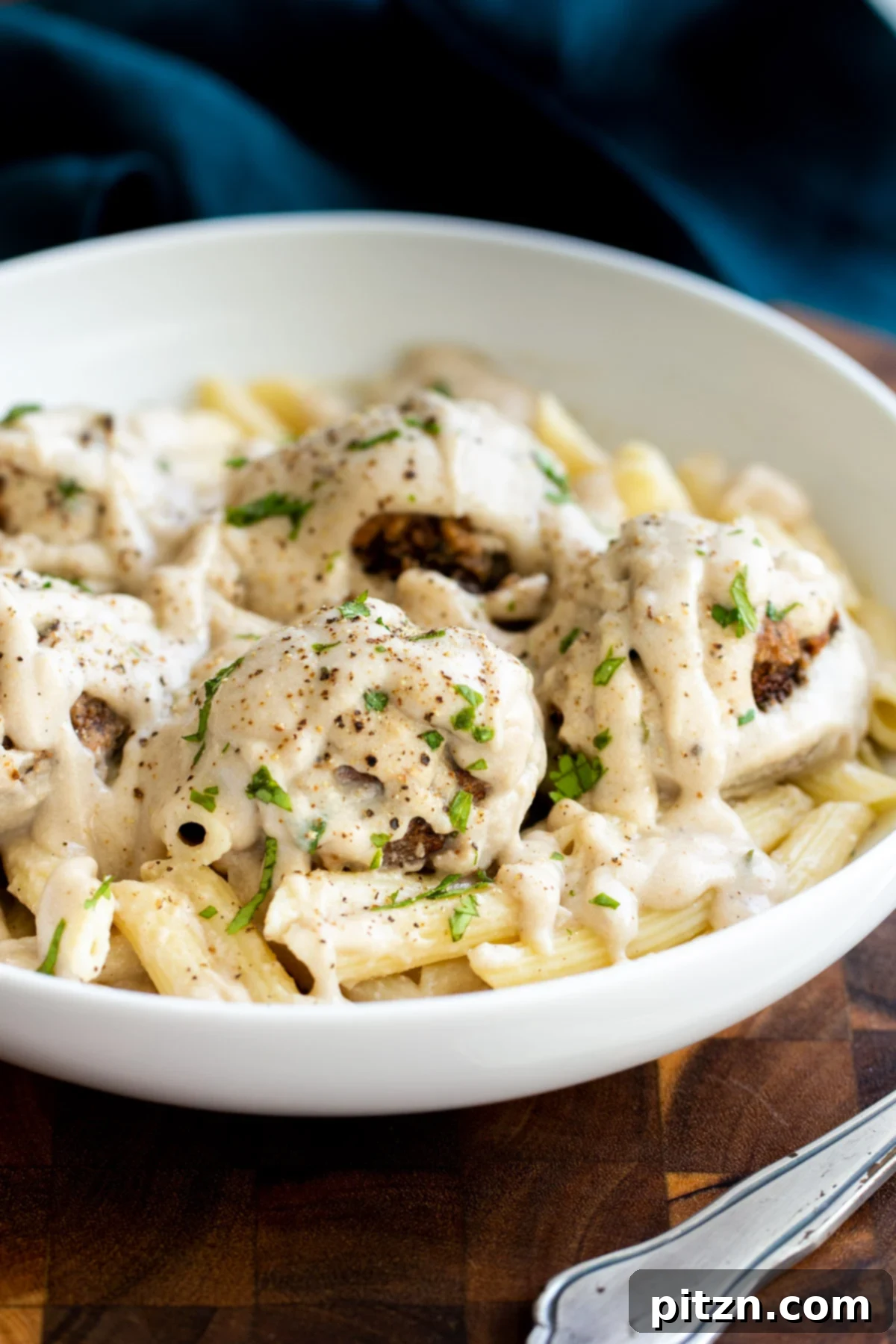 Swedish Plant-Ball Perfection 4 Classic Swedish meatballs presentation, showcasing vegan mushroom balls over pasta with a rich gravy.