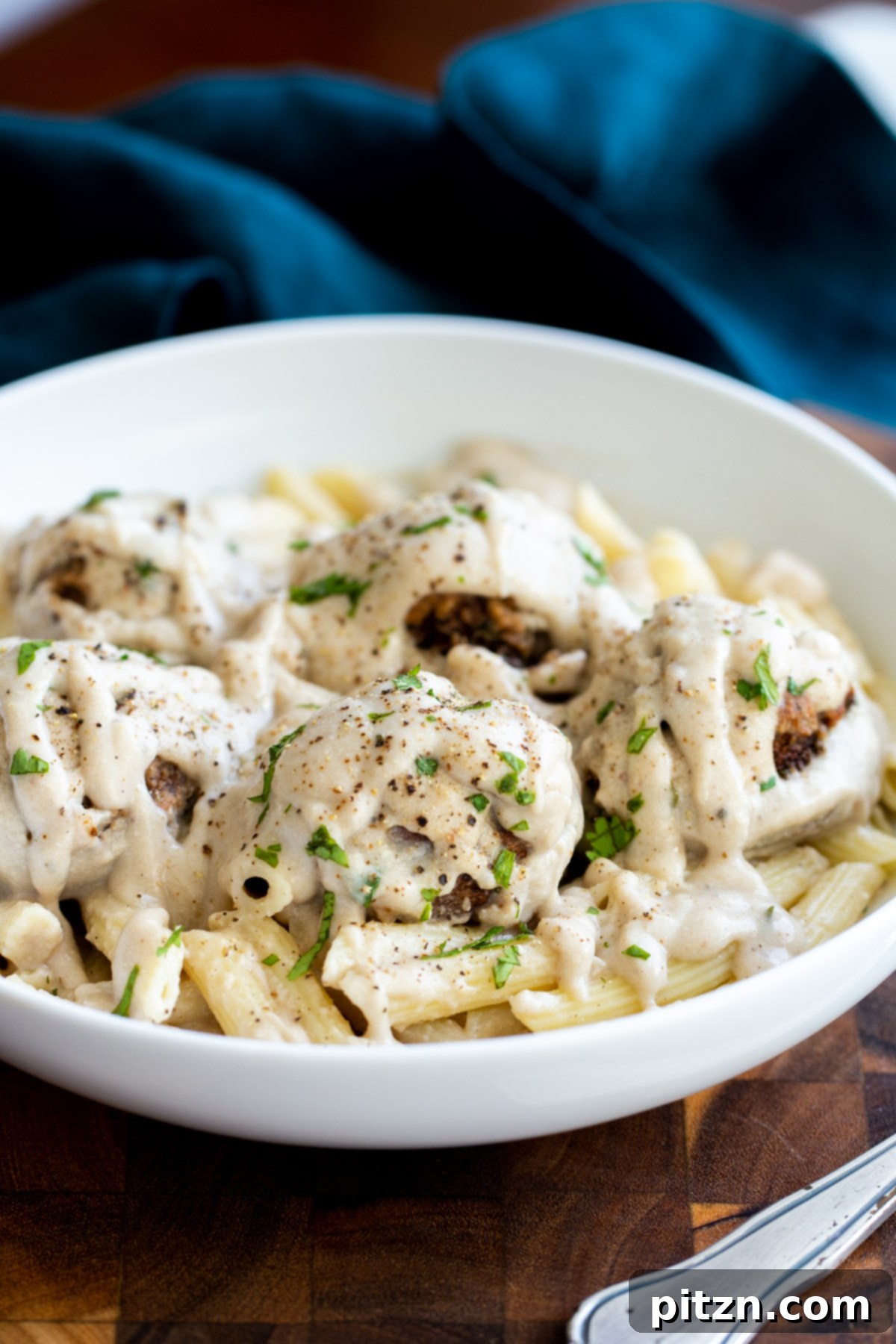 Swedish Plant-Ball Perfection 6 A dish of vegan Swedish mushroom meatballs served over pasta, showcasing the rich gravy.