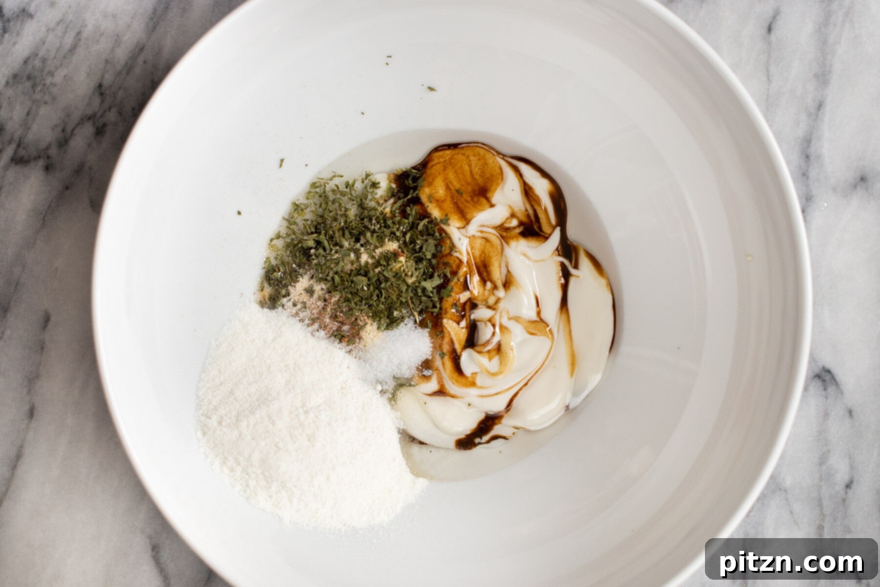 Swedish Plant-Ball Perfection 9 Close-up of mushroom marinade ingredients beautifully mixed in a white bowl.