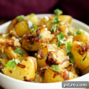 A vibrant plate featuring the completed Potato Pepper Fry, garnished with fresh herbs and spices.