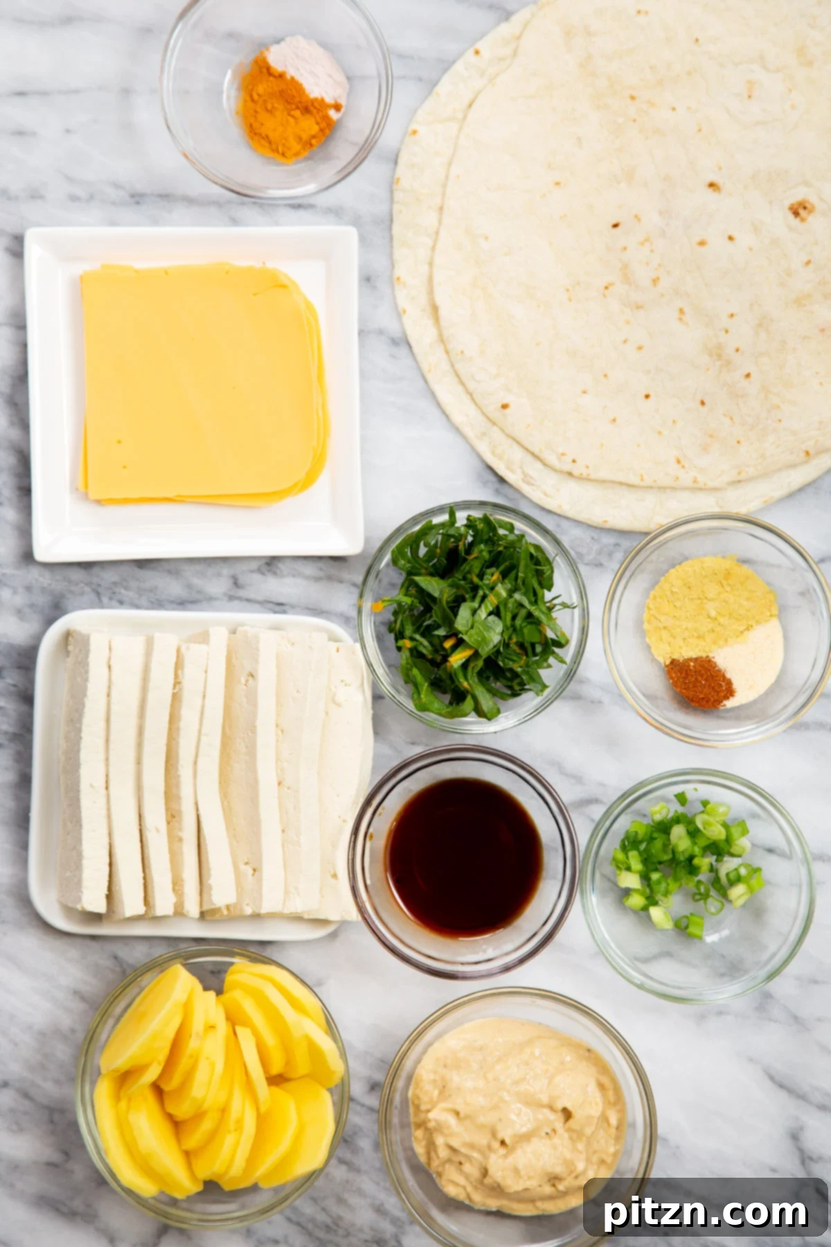 Smoky Tofu and Potato Sunrise Quesadillas 6 A vibrant display of fresh ingredients needed for making a savory vegan breakfast quesadilla, including tofu, potatoes, greens, and spices.
