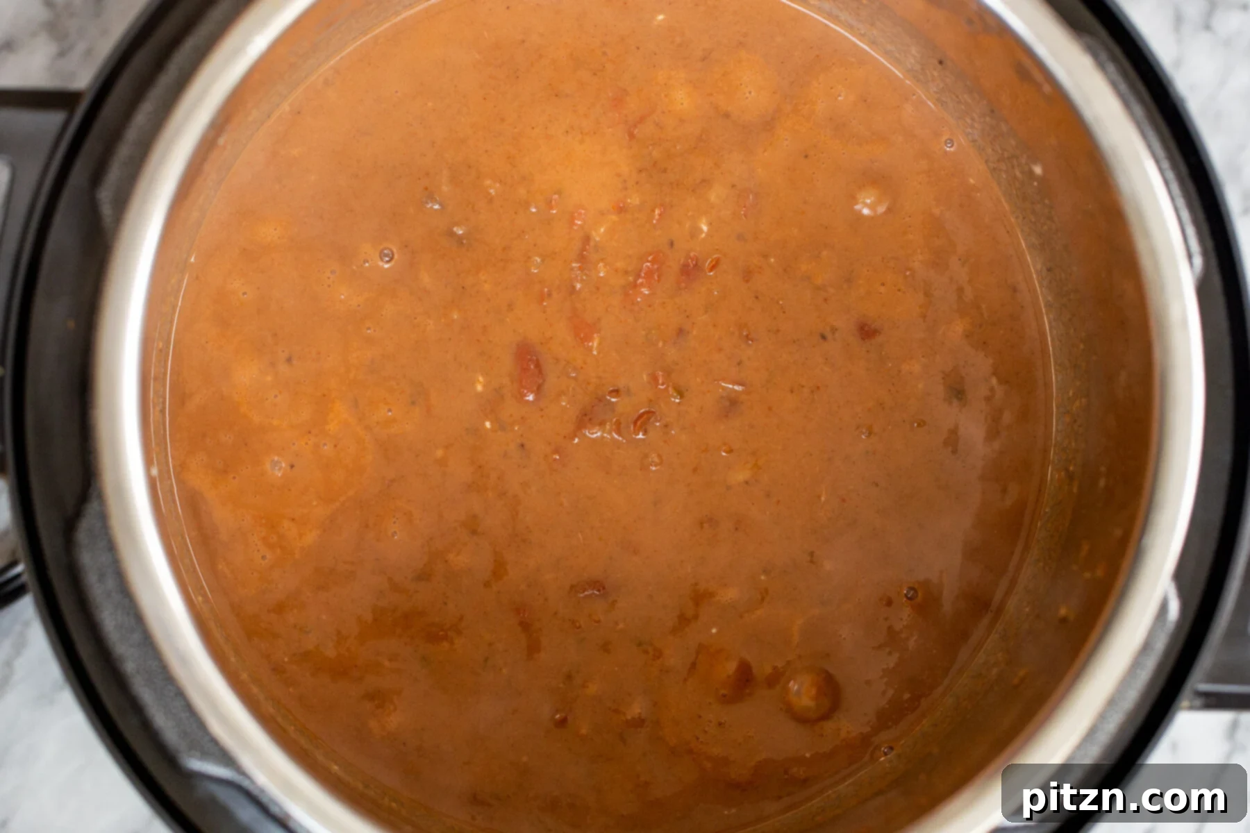 Instant Pot Dhaba Rajma: Authentic & Easy Kidney Bean Curry 13 Indian Kidney Bean Curry (Dhaba Wale Rajma) simmering in an Instant Pot, reaching perfect consistency