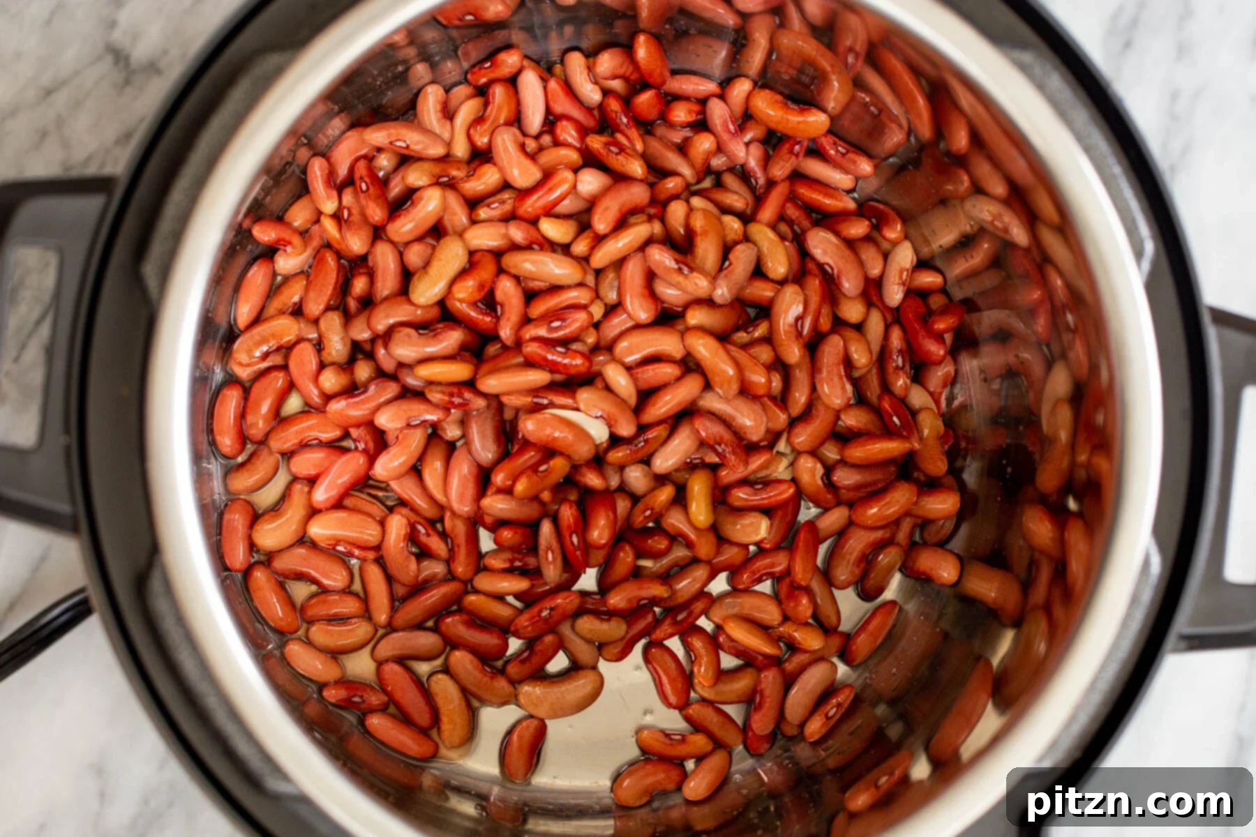 Instant Pot Dhaba Rajma: Authentic & Easy Kidney Bean Curry 7 an Instant Pot inner pot with dry red kidney beans, ready for soaking