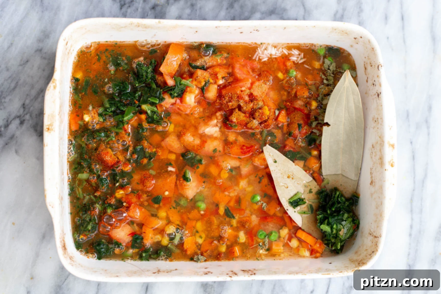 Spiced Kitchari Comfort Bake 12 The combined mixture of rice, lentils, and vegetables, thoroughly mixed in a casserole dish and ready for baking, promising a delicious and aromatic Kitchari.