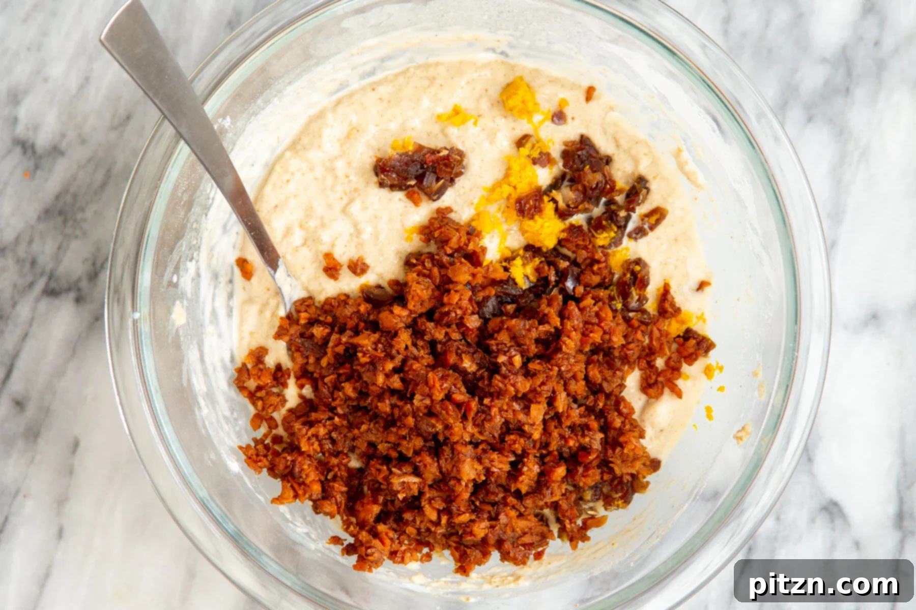 Spiced Vegan Carrot Cake Squares 17 Carrots and orange zest being added to carrot cake batter