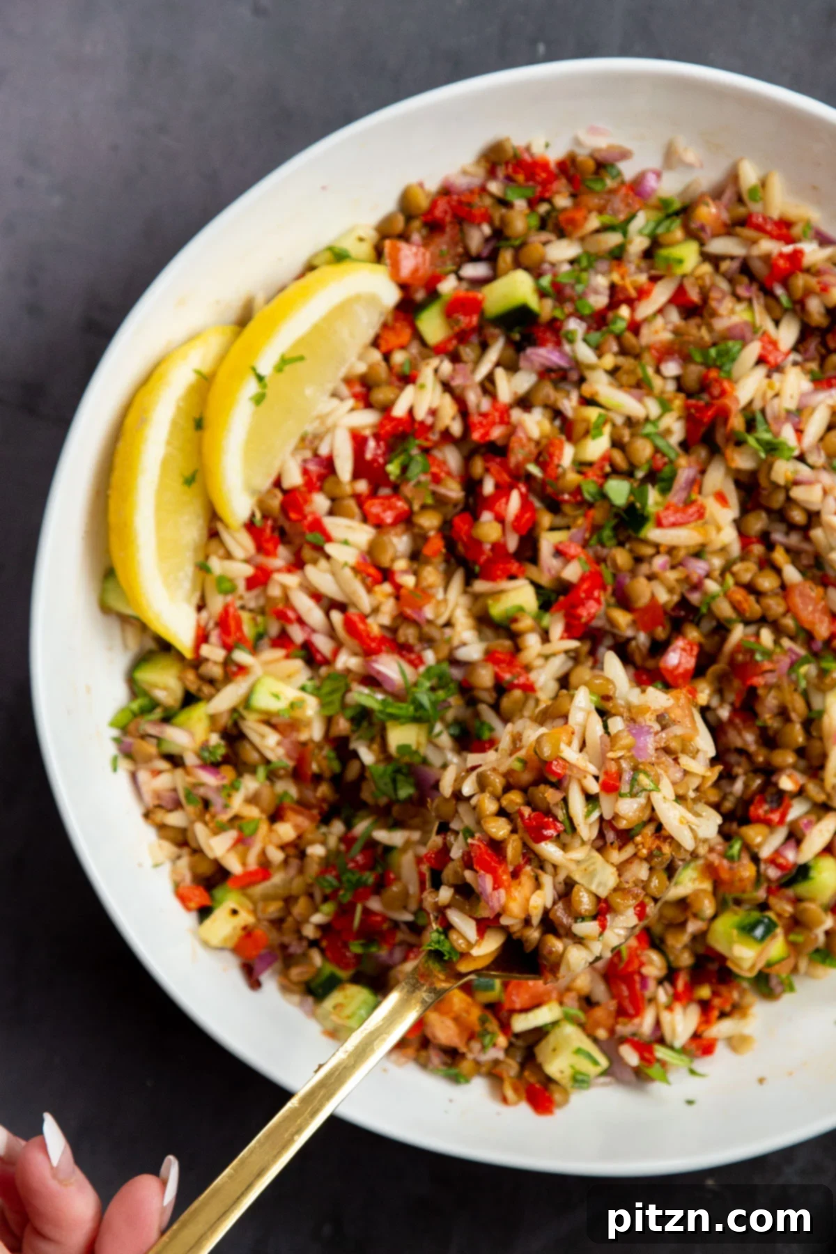 A close-up shot of a lentil farro salad bowl, showcasing the rich texture of farro mixed with lentils and fresh vegetables, ready to be enjoyed.