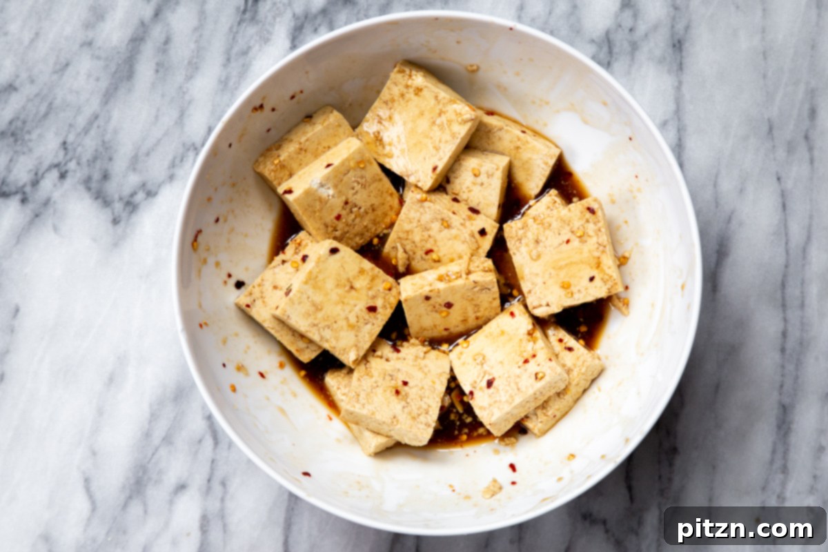 slices of pressed marinated tofu in a small bowl