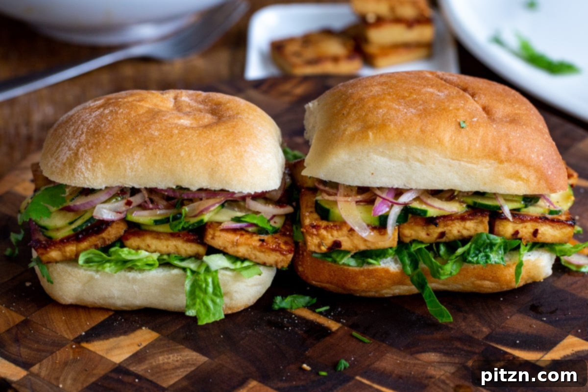 vegan chili garlic tofu sandwiches on a chopping board