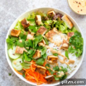 Crunchy Veggie Vegan Summer Rolls Deconstructed into a Bowl. Served with Peanut Butter Dipping Sauce.