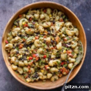 Southwestern pasta salad in a wooden bowl with cilantro
