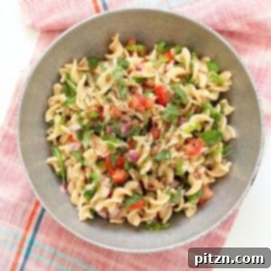 Tabbouleh Pasta Salad. Parsley, tomatoes, fusilli pasta dressed with olive oil, salt, pepper and lemon. Fresh Summer Salad.