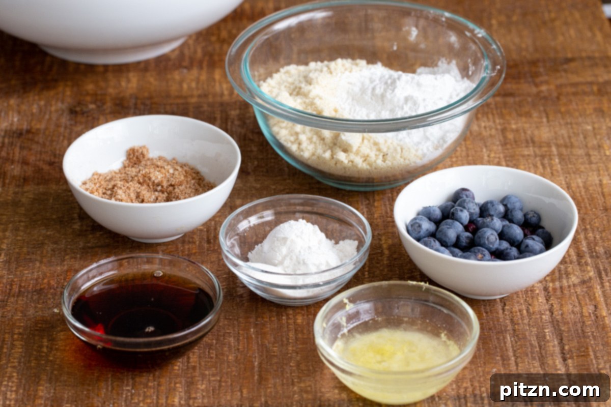 Gluten-Free Vegan Blueberry Muffin Cookies 6 All ingredients laid out on a white surface, ready for making Vegan Blueberry Muffin Cookies. This ensures everything is at hand for the Gluten-Free recipe.